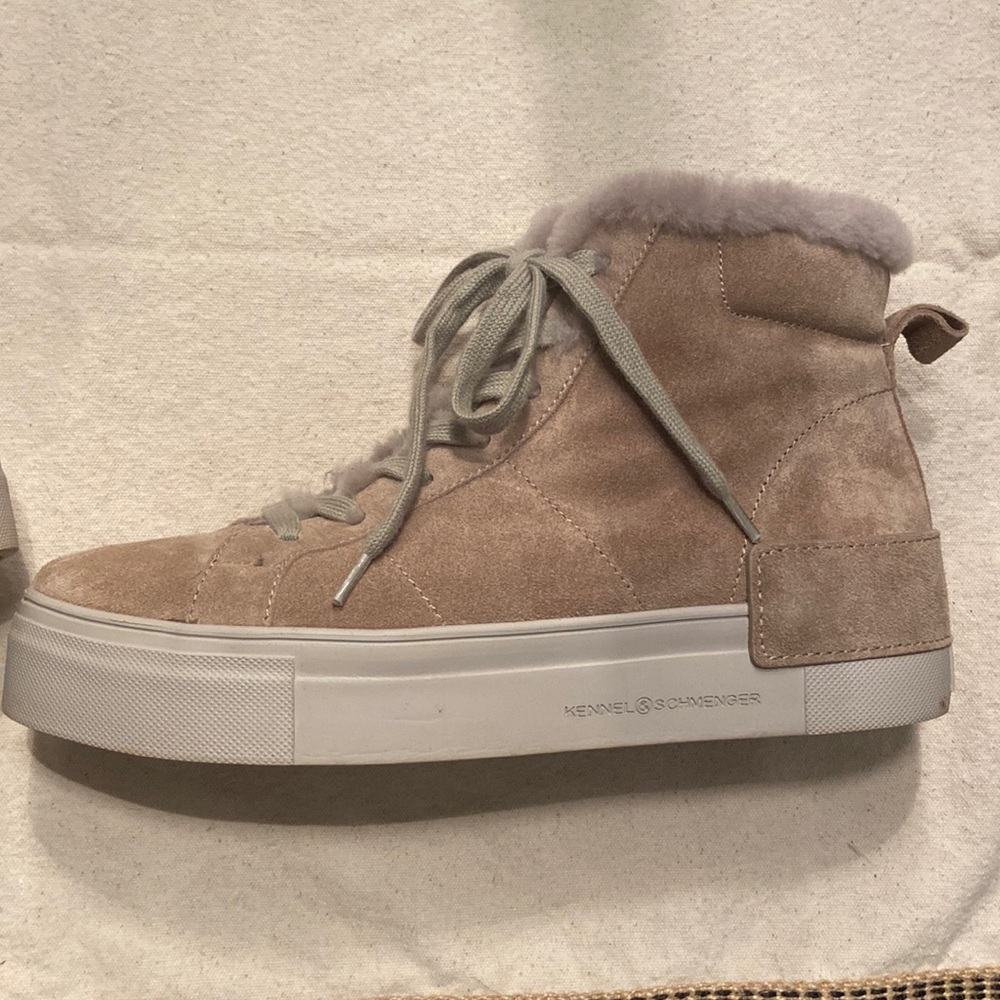 Sneakers fully lined with fur! Zip on and off. Only worn a few times.